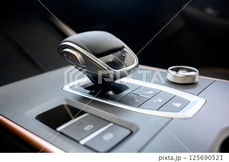 Automatic transmission selector in the interior of a modern car. Automatic transmission selector in the interior of a modern car. 125690521