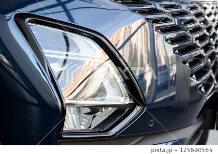 Close up of the headlight of a new modern car Close up of the headlight of a new modern car 125690565
