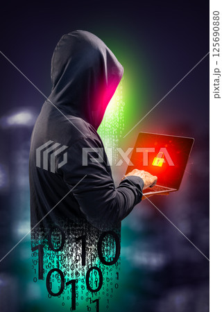 Faceless hackers and malware hackers use laptops with dangerous digital code on binary code background. 125690880