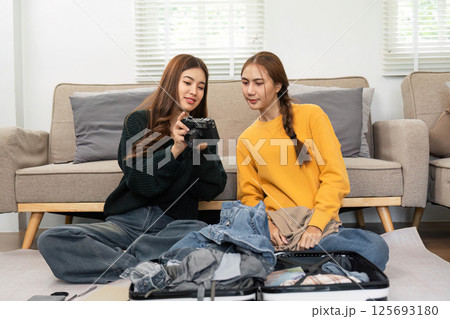Capturing Memories: Friends Exploring while Packing for Travel 125693180