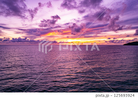 Aerial view sunset sky,Nature beautiful light sunset or sunrise over sea surface,Colorful sunset sky with clouds and waves in the ocean,Wide angle sea background 125693924