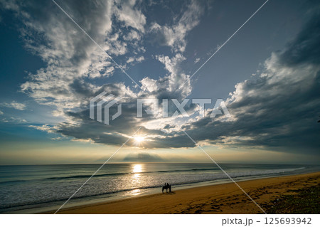 Aerial view sunset sky,Nature beautiful light sunset or sunrise over sea surface,Colorful sunset sky with clouds and waves in the ocean,Wide angle sea background 125693942