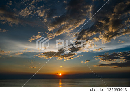 Aerial view sunset sky,Nature beautiful light sunset or sunrise over sea surface,Colorful sunset sky with clouds and waves in the ocean,Wide angle sea background Aerial view sunset sky,Nature beautiful light sunset or sunrise over sea surface,Colorful sunset sky with clouds and waves in the ocean,Wide angle sea background 125693948