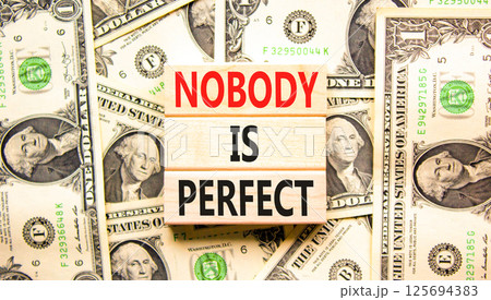 Nobody is perfect symbol. Concept words Nobody is perfect on beautiful block. Dollar bills. Beautiful background from dollar bills. Business motivational lifestyle nobody is perfect concept Copy space Nobody is perfect symbol. Concept words Nobody is perfect on beautiful block. Dollar bills. Beautiful background from dollar bills. Business motivational lifestyle nobody is perfect concept Copy space 125694383