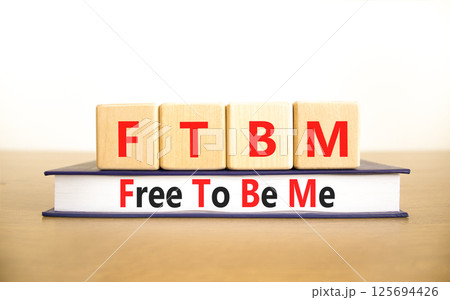 FTBM Free To Be Me symbol. Concept word FTBM Free To Be Me on beautiful wooden blocks and book. Beautiful white background. Business motivational FTBM Free To Be Me concept. Copy space. FTBM Free To Be Me symbol. Concept word FTBM Free To Be Me on beautiful wooden blocks and book. Beautiful white background. Business motivational FTBM Free To Be Me concept. Copy space. 125694426