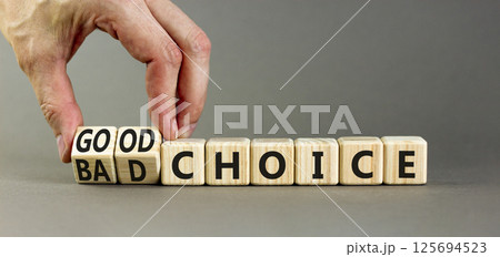 Good or bad choice symbol. Concept words Good choice or Bad choice on beautiful wooden blocks. Beautiful grey table grey background. Businessman hand. Business good bad choice concept. Copy space. 125694523