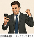 スマホを見てガッツポーズする西洋のビジネスマン 125696163