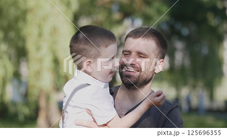 Happy father and son portrait in the city park Happy father and son portrait in the city park 125696355