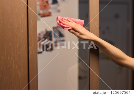 Meticulously Cleaning the Glass Surface with Care and Attention to Detail and Efficiency 125697564