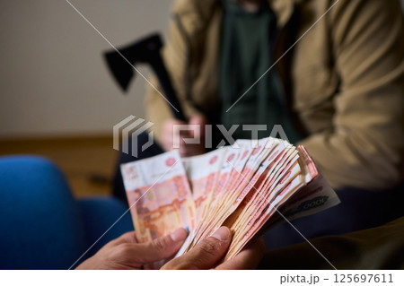 A Cash Transaction That Carries Unsettling and Uneasy Undertones of Tension and Anxiety A Cash Transaction That Carries Unsettling and Uneasy Undertones of Tension and Anxiety 125697611