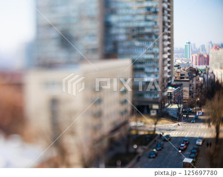 Unique tilt-shift perspective of a vibrant Kyiv city street scene 125697780