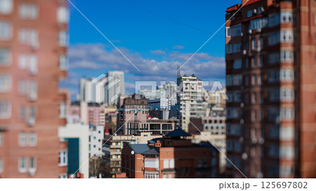 View into a dense urban cityscape under a blue sky View into a dense urban cityscape under a blue sky 125697802