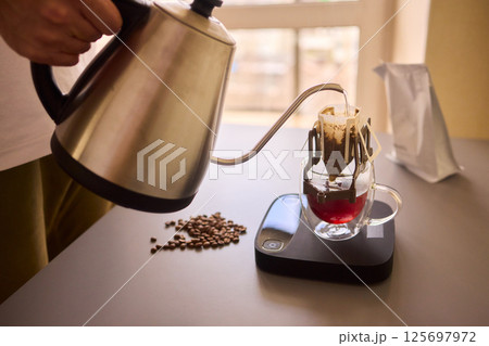Brewing Coffee with a Precision Pouring Kettle for an Enhanced Experience and Enjoyment 125697972