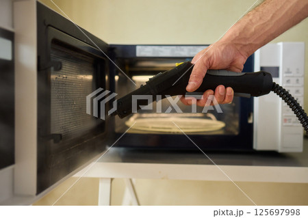 Achieve Efficient Microwave Cleaning with Innovative Steam Technology and Modern Tools, Comfortably 125697998