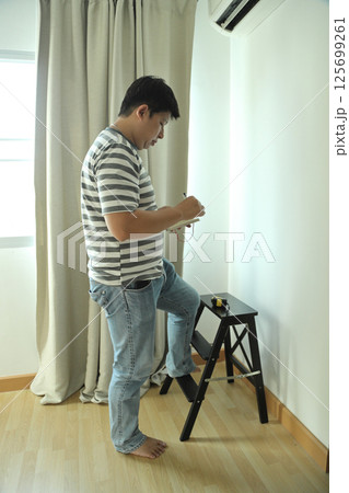 East Asian Man 125699261