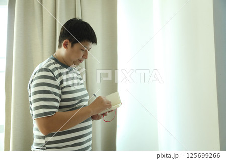 East Asian Man 125699266