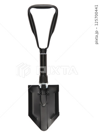 Black folding camping shovel isolated on white background. Army portable tool 125700441