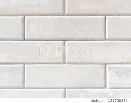 White Stone Wall with Rectangular Blocks Texture 125700852