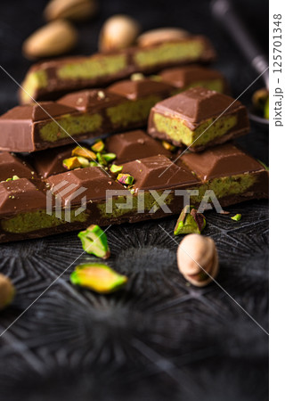 Dubai chocolate with kadayif pistachio filling 125701348