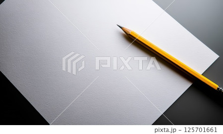 Blank Sheet of Paper with a Yellow Wooden Pencil on Dark Surface Blank Sheet of Paper with a Yellow Wooden Pencil on Dark Surface 125701661