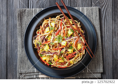 Thai Mango Noodle Veggie Salad in a bowl 125702922