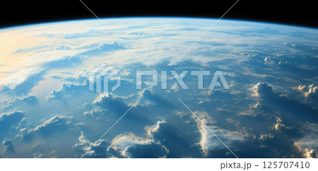 Earth embraces the sun with atmospheric clouds at dawn, showcasing global weather patterns. 125707410