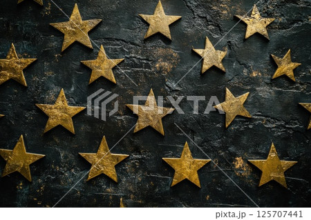 Golden Stars Shine Brightly on Dark Background, Creating Celestial Atmosphere. 125707441