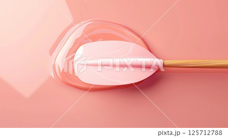 Pink paddle on a pink surface with a pink puddle Pink paddle on a pink surface with a pink puddle 125712788