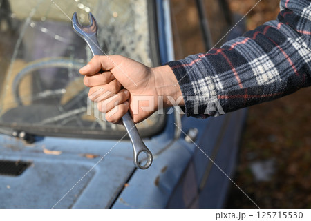 Repair of an old car that was in an accident, with broken windshield Repair of an old car that was in an accident, with broken windshield 125715530