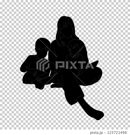 Silhouette of a mother sitting and reading a picture book to her baby and boy 125721498