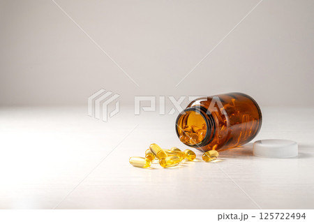 Capsules of omega 3, 6, 9 fish oil, vitamin isolated on white background. Capsules of omega 3, 6, 9 fish oil, vitamin isolated on white background. 125722494