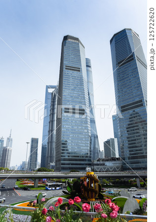 Shanghai, China - 1 April 2025: Modern skyscrapers including Shanghai Tower and Shanghai World Financial Center in Pudong financial district with urban traffic. Shanghai, China - 1 April 2025: Modern skyscrapers including Shanghai Tower and Shanghai World Financial Center in Pudong financial district with urban traffic. 125722620