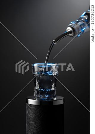Vodka pouring from the bottle into a glass on a dark background. Vodka pouring from the bottle into a glass on a dark background. 125723212