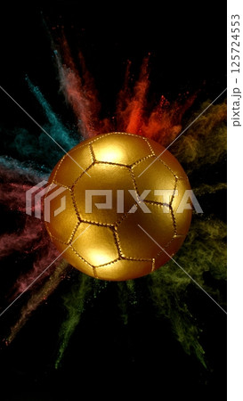 Soccer golden ball with coloured powder explosion. 125724553
