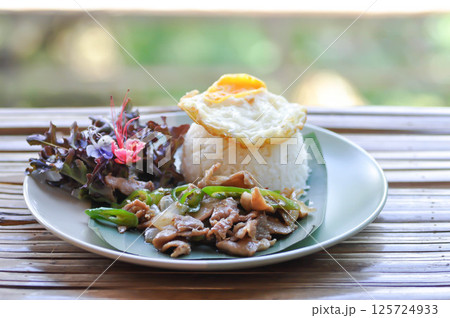 stir fried pork with vegetable or stir fried green pepper and pork with rice and sunny side up egg or fried egg stir fried pork with vegetable or stir fried green pepper and pork with rice and sunny side up egg or fried egg 125724933