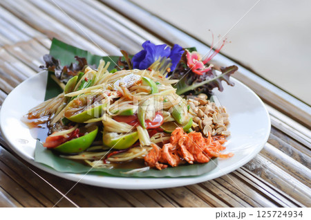 spicy salad, som tam or Thai spicy salad or papaya salad 125724934