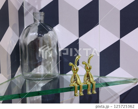 Elegant Glass Bottle with Golden Rabbit Figurines perfect for enhancing any setting 125725362