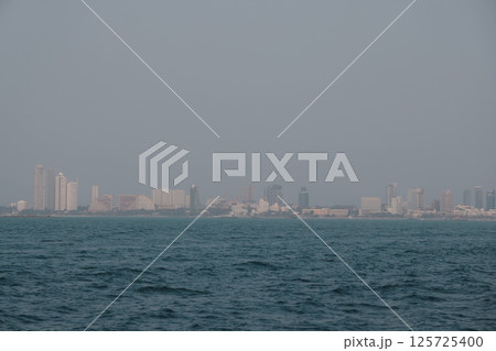 Experience a stunning Coastal Skyline a breathtaking City View stretching across the serene water 125725400