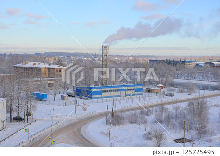 A Snowy Industrial Landscape Featuring Emissions Visible from Above and Surrounding Areas A Snowy Industrial Landscape Featuring Emissions Visible from Above and Surrounding Areas 125725495