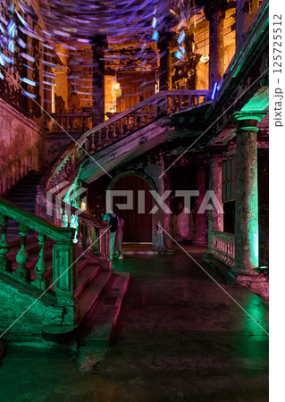 Experience the Haunting Elegance of an Abandoned Staircase illuminated by Dramatic Lighting Experience the Haunting Elegance of an Abandoned Staircase illuminated by Dramatic Lighting 125725512