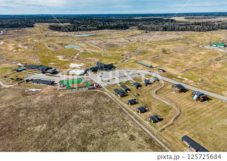 A breathtaking Aerial View of an Expansive Nature Resort Set Amidst a Beautiful Rural Landscape 125725684