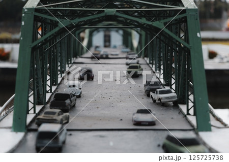 Miniature Bridge display with Model Cars, highlighting intricate details and design elements 125725738