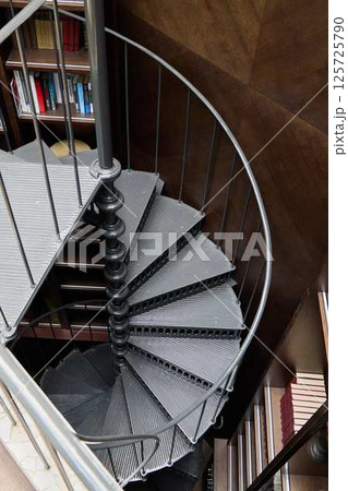 An Elegant Spiral Staircase Featured in a Modern Interior Design Setting That Captivates An Elegant Spiral Staircase Featured in a Modern Interior Design Setting That Captivates 125725790
