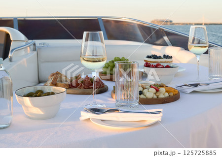 Experience a Gourmet Dining Adventure on a Luxurious Yacht While Enjoying the Sunset View 125725885