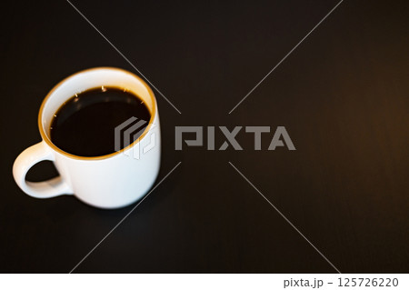 Coffee Mug On Wooden Table. Background for advertising and wallpaper in drink and coffee scene. 125726220