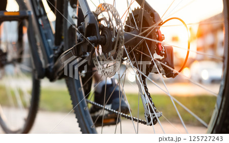 Close Up Of Bicycle Gear Mechanism On A Rear Wheel Close Up Of Bicycle Gear Mechanism On A Rear Wheel 125727243