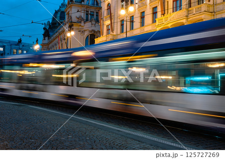 Tram Trails Illuminate A Night Prague Street, Fast-Moving Public Transport 125727269