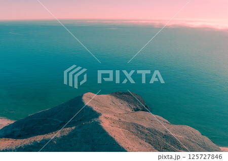 Rock in the sea. Crescent Cove. Aerial view. Cabo de Gata-Nijar reserve. Monsul cove. Almeria Andalusia Spain 125727846