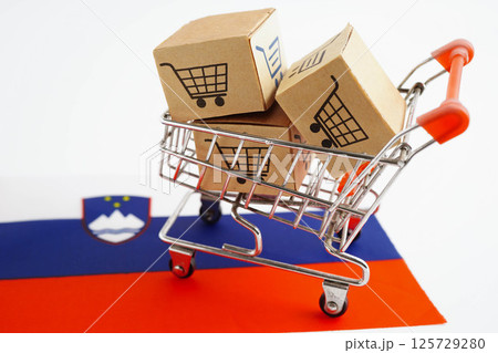 Online shopping, Shopping cart box on Slovenia flag, import export, finance commerce. 125729280