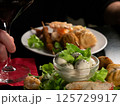 Elegant Dining: Red Wine and Gourmet Appetizers 125729917